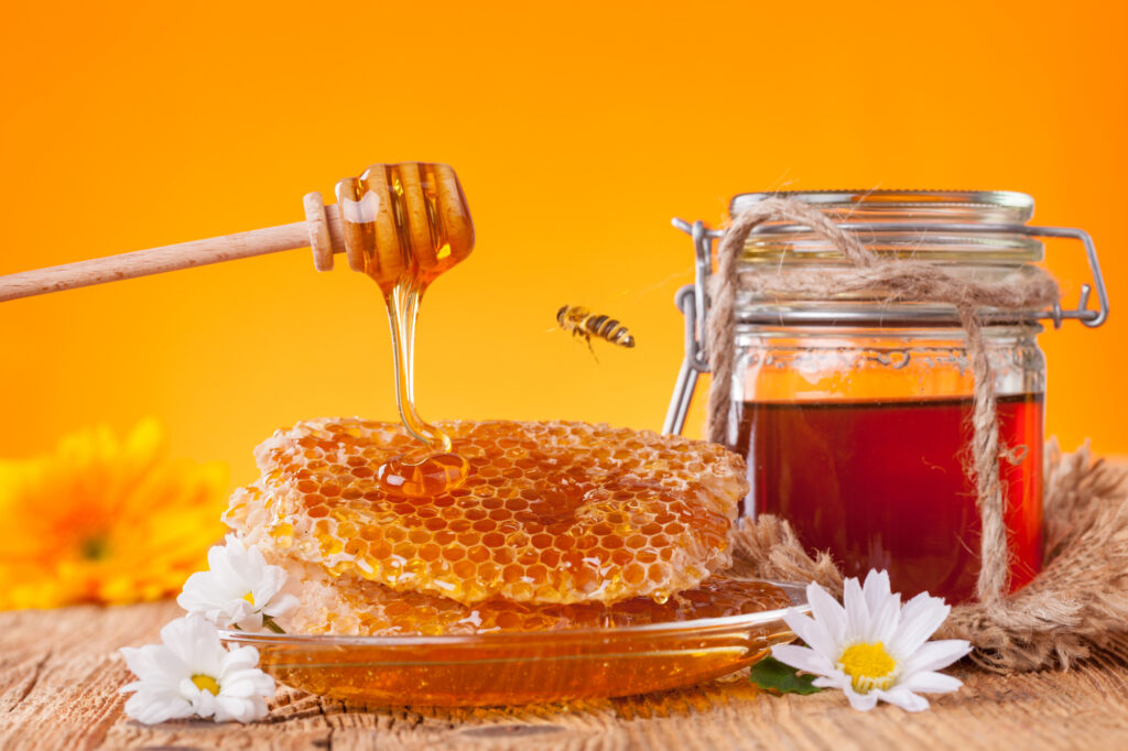 Fresh honey with dipper